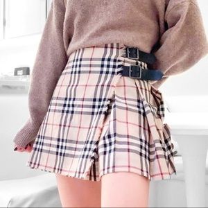 Authenticated Burberry Pleated Skirt Size 4. Still has tags of authentication on